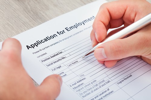 Hand Filling Out Form 