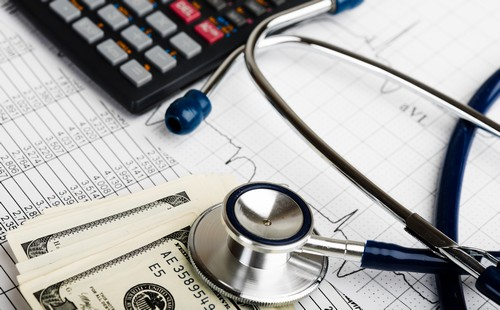 Stethoscope on Paperwork and Money